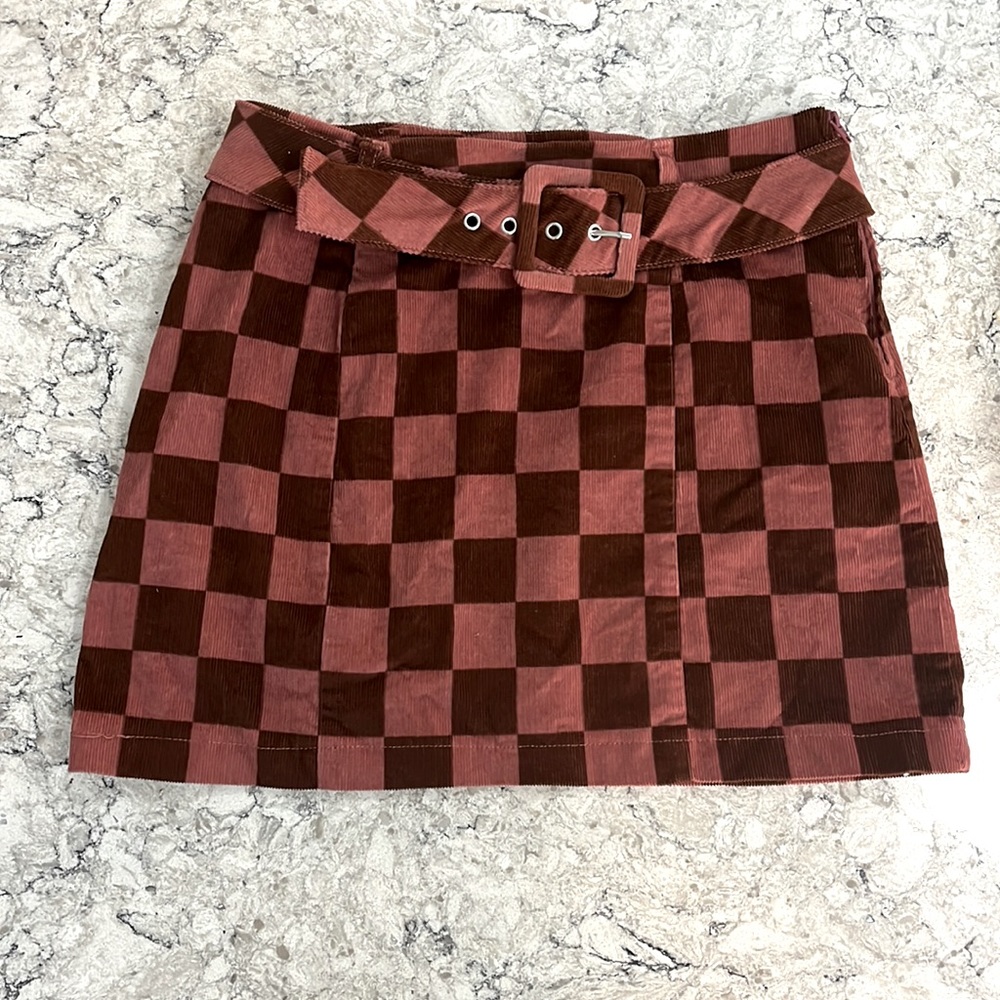 Pink and brown checkered skirt.